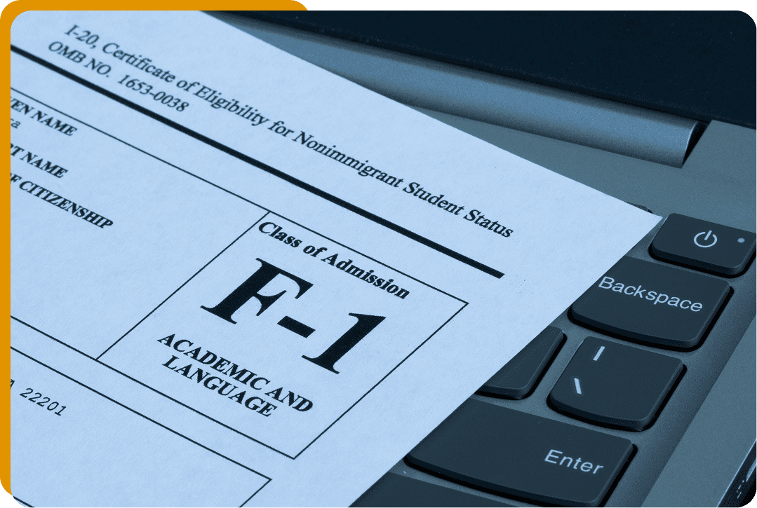 F-1 visa document on laptop keyboard